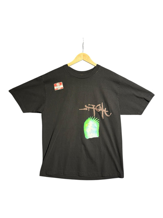 OutOf10 black Stussy cotton t-shirt with a hand-drawn logo and vibrant neon green graphic print on the front.