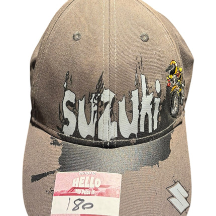 OutOf10 Suzuki graphic baseball cap in a neutral taupe colour with a distressed logo and structured pre-curved brim.