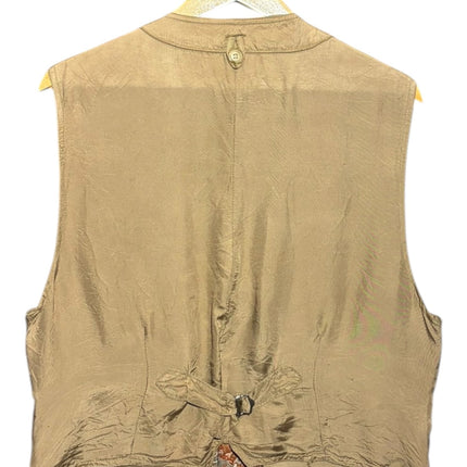 OutOf10 vintage-inspired waistcoat back view featuring solid tan fabric, adjustable cinch strap, and patterned hem.