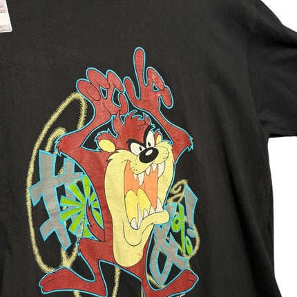 OutOf10 black cotton crewneck t-shirt featuring a vibrant Tasmanian Devil graphic print with graffiti-style accents.
