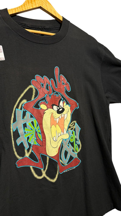 OutOf10 black cotton crewneck t-shirt featuring a vibrant Tasmanian Devil graphic print with graffiti-style accents.