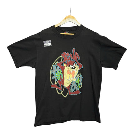 OutOf10 black cotton crewneck t-shirt featuring a vibrant Tasmanian Devil graphic print with graffiti-style accents.
