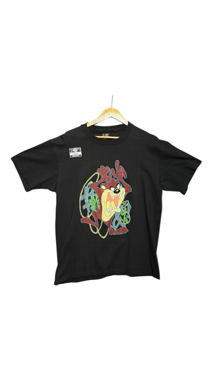 OutOf10 black cotton crewneck t-shirt featuring a vibrant Tasmanian Devil graphic print with graffiti-style accents.