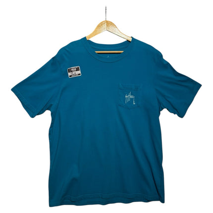 OutOf10 teal Guy Harvey cotton crew neck t-shirt with a chest pocket and signature logo on a wooden hanger