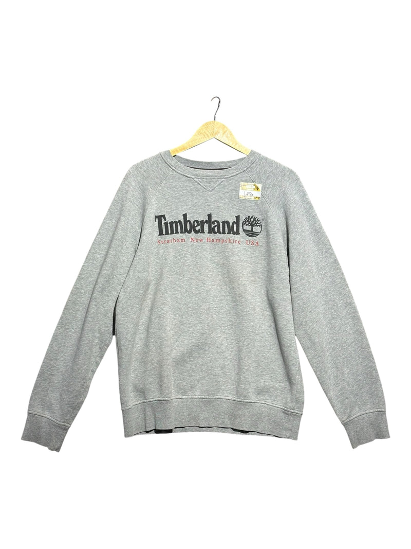 OutOf10 grey marl Timberland crewneck sweatshirt with heritage logo and ribbed trim on a wooden hanger