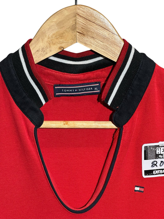 OutOf10 Tommy Hilfiger sleeveless red polo dress with a V-neckline and striped ribbed collar on a wooden hanger.