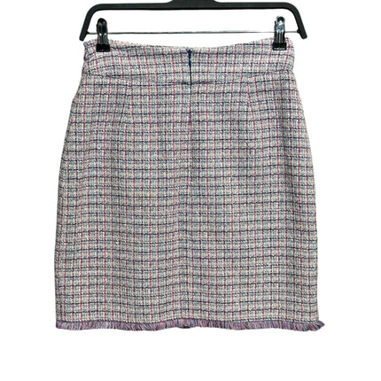 OutOf10 textured tweed mini skirt in pink, navy, and cream check pattern with a frayed hemline on a hanger.