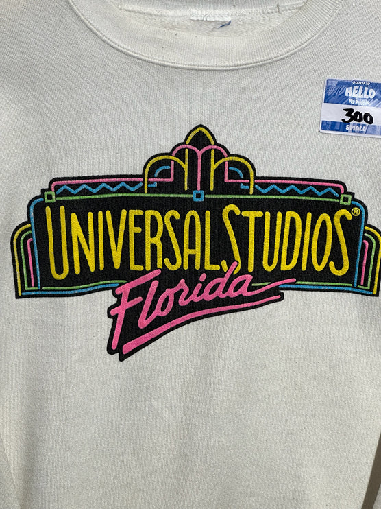 OutOf10 vintage off-white crewneck sweatshirt featuring a vibrant neon Universal Studios Florida graphic print.
