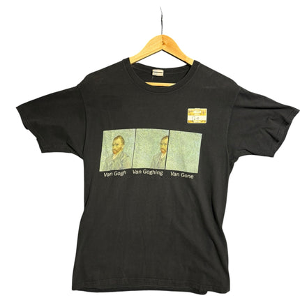 OutOf10 black cotton crewneck t-shirt featuring a humorous Van Gogh evolution graphic print on a wooden hanger.