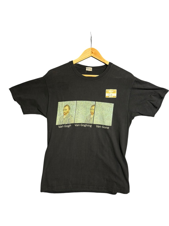 OutOf10 black cotton crewneck t-shirt featuring a humorous Van Gogh evolution graphic print on a wooden hanger.