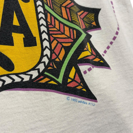 OutOf10 vintage 1993 Adidas Argentina football graphic t-shirt featuring a tribal-inspired AFA crest design