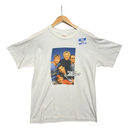 OutOf10 vintage off-white Backstreet Boys graphic t-shirt with a 90s boy band portrait print on a wooden hanger.