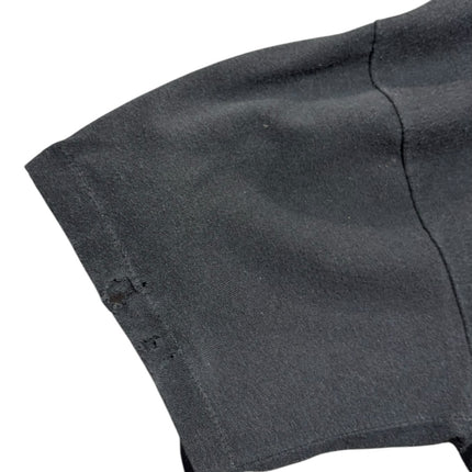 OutOf10 vintage black cotton t-shirt sleeve showing a small subtle distress detail for a worn-in racing aesthetic