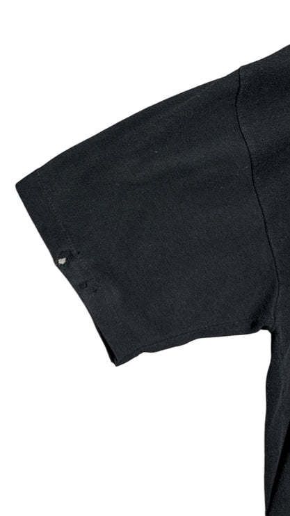 OutOf10 vintage black cotton t-shirt sleeve showing authentic distress marks and small holes from wear