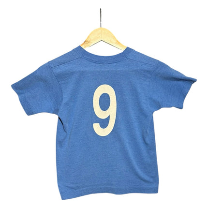 OutOf10 vintage blue youth soccer t-shirt with a large white number 9 printed on the back, hanging on a hanger.