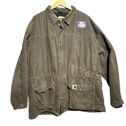 OutOf10 vintage brown Carhartt canvas field jacket with distressed patina, front pockets, and logo patch on hanger.