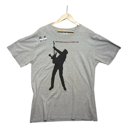 OutOf10 vintage grey Bryan Adams Waking Up The World tour t-shirt with black silhouette graphic on a wooden hanger