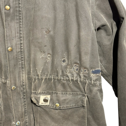 OutOf10 vintage brown Carhartt canvas field jacket with distressed wear, utility pockets, and logo patch.