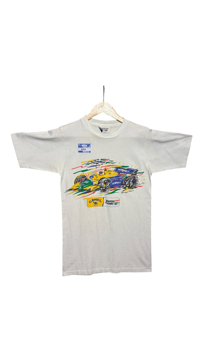 OutOf10 vintage white Formula 1 graphic t-shirt featuring a colorful Benetton race car illustration on a hanger.