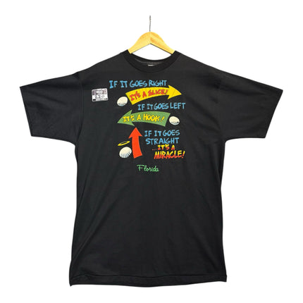 OutOf10 black cotton crewneck t-shirt featuring a vintage golf humor graphic print about golf swings on a hanger.