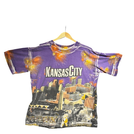 OutOf10 vintage purple crewneck t-shirt featuring a vibrant Kansas City skyline graphic print with firework accents.