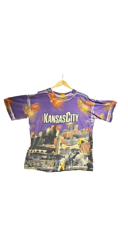 OutOf10 vintage purple crewneck t-shirt featuring a vibrant Kansas City skyline graphic print with firework accents.