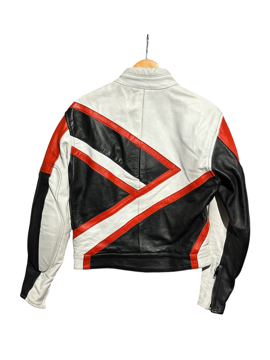Back view of an OutOf10 vintage leather motorcycle jacket featuring a white, black, and red geometric panel design.