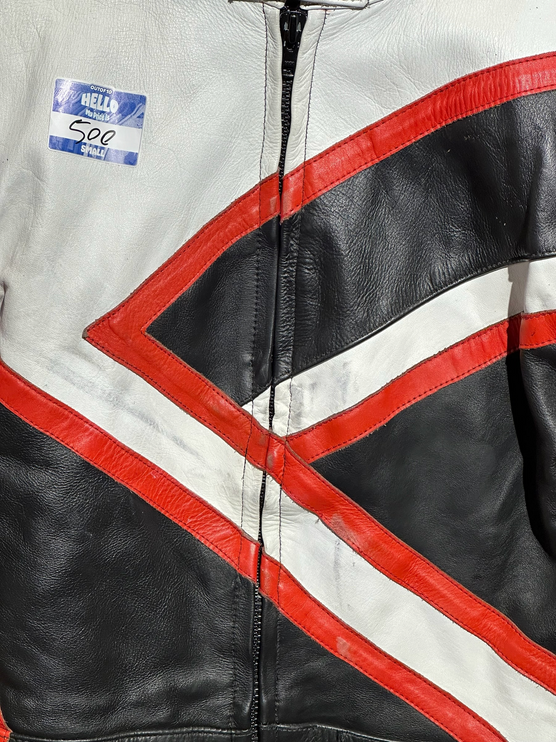 OutOf10 vintage leather motorcycle jacket featuring a bold geometric tri-colour design in white, black, and red.