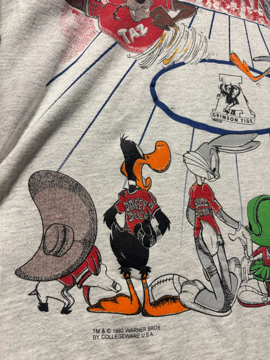 OutOf10 vintage 1993 Looney Tunes Alabama Crimson Tide graphic t-shirt featuring Taz, Daffy Duck, and Bugs Bunny.
