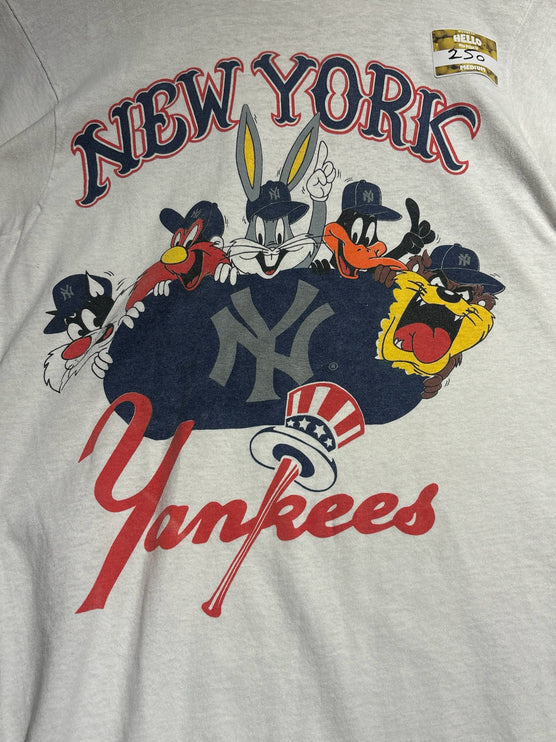 OutOf10 off-white cotton t-shirt featuring a vintage Looney Tunes and New York Yankees graphic print.