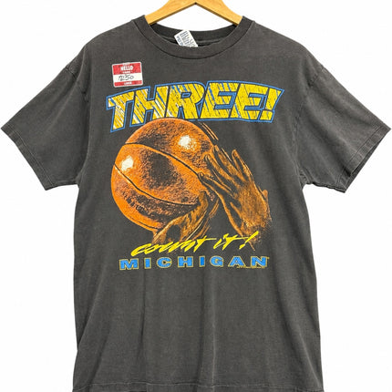 OutOf10 vintage charcoal grey Michigan basketball graphic crewneck t-shirt with Three! count it! slogan on a hanger
