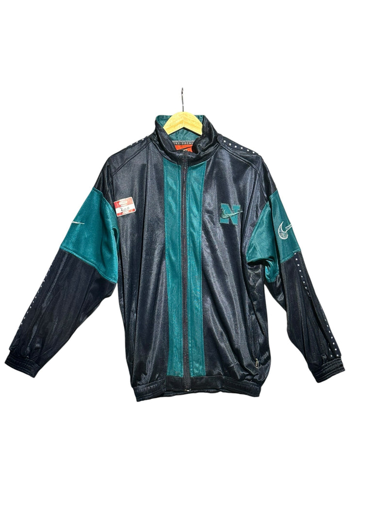 OutOf10 vintage Nike full zip track jacket in black and teal with embroidered N logo and star pattern sleeve details.