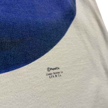 OutOf10 vintage white Pepsi t-shirt featuring a blue graphic logo and PepsiCo licensing detail on soft cotton fabric