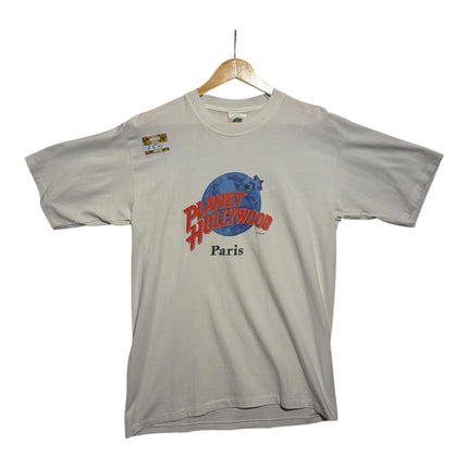 OutOf10 vintage white Planet Hollywood Paris graphic crewneck t-shirt with red and blue globe logo on a hanger