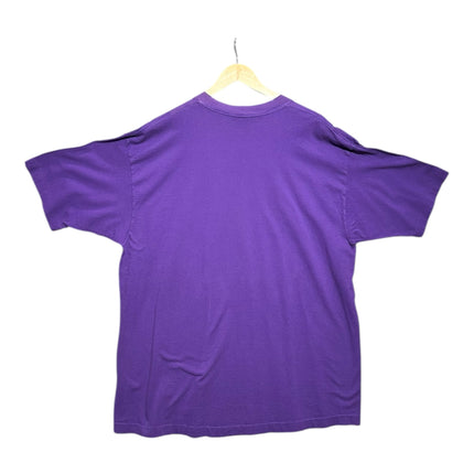 OutOf10 vintage purple cotton t-shirt with a plain back, hanging on a wooden hanger against a white background.