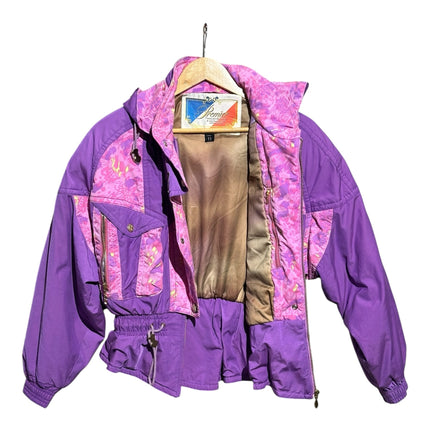 OutOf10 vintage Premier hooded ski jacket in purple with pink and yellow abstract floral pattern and gold hardware.