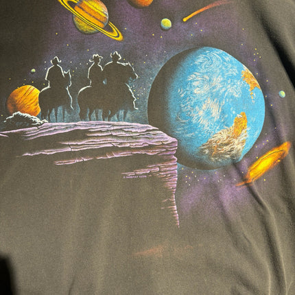 OutOf10 vintage washed-black cotton t-shirt featuring a space-western graphic of cowboys on a planet landscape