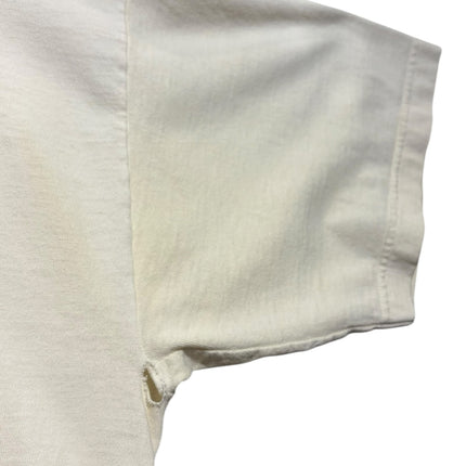OutOf10 vintage off-white cotton t-shirt showing underarm wear and small hole on the sleeve seam