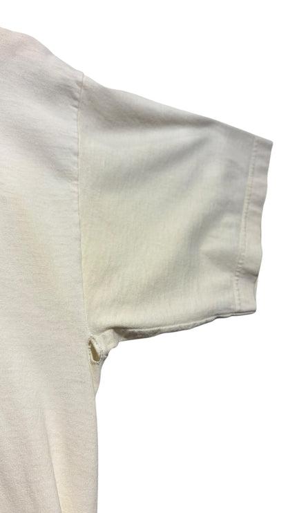 OutOf10 vintage off-white cotton t-shirt showing underarm wear and small hole on the sleeve seam