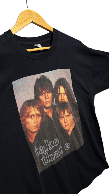 OutOf10 vintage black cotton crewneck t-shirt featuring a 1995 Take That band graphic on a wooden hanger