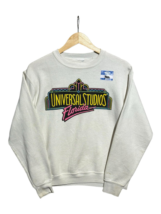 OutOf10 vintage off-white crewneck sweatshirt featuring a colourful 90s Universal Studios Florida neon graphic print.
