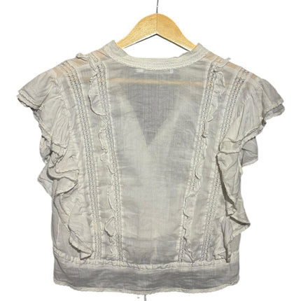 OutOf10 white vintage-style blouse with ruffled shoulders, lace trim inserts, and a drawstring hem on a hanger.