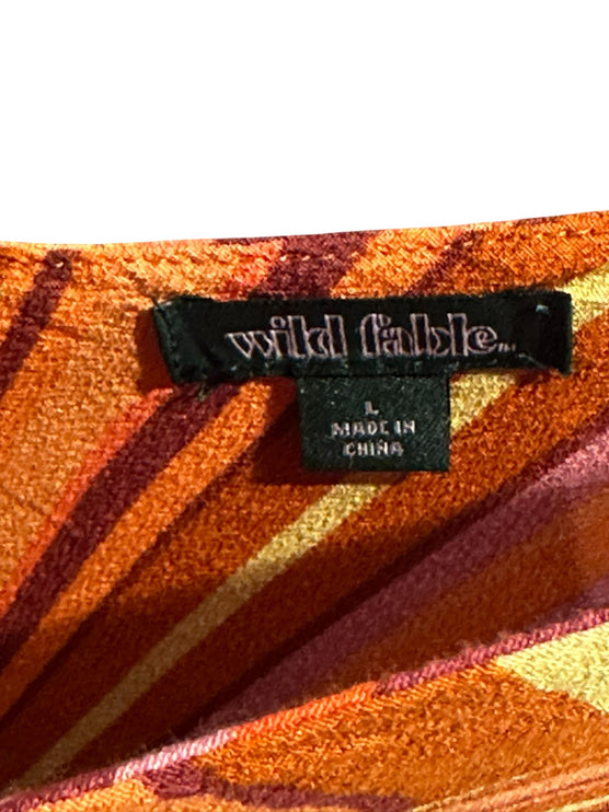 OutOf10 Wild Fable sleeveless mini dress label showing size L and sunset orange, pink, and yellow striped fabric