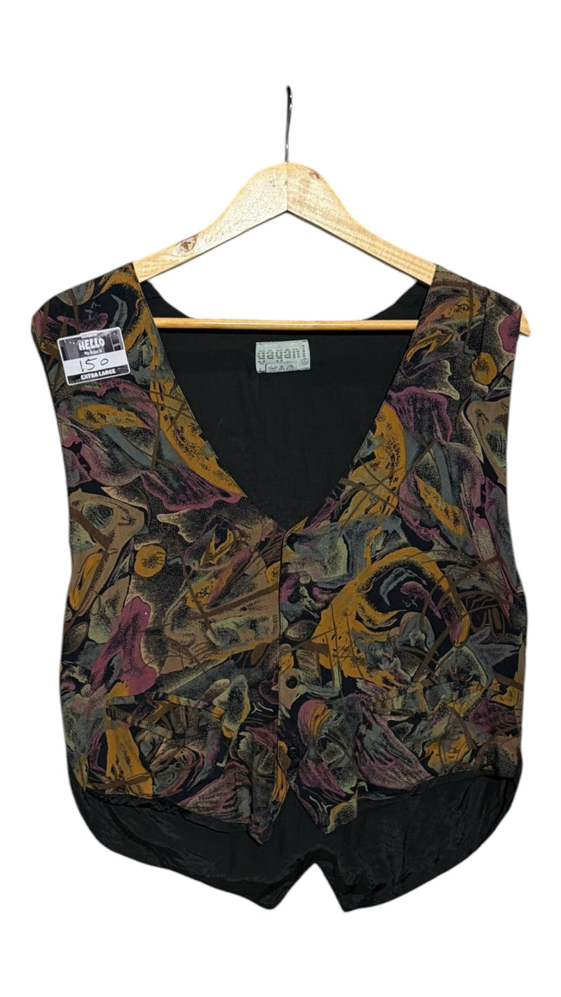 OutOf10 yagan sleeveless waistcoat featuring a vibrant abstract pattern in mustard, purple, and charcoal on a hanger.