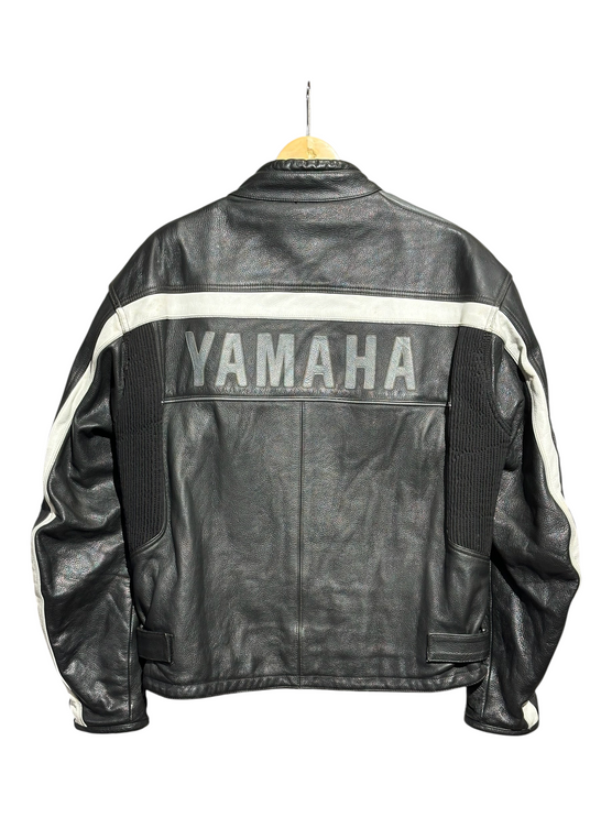 Back view of OutOf10 Yamaha black leather motorcycle jacket with white contrast stripes and bold Yamaha logo.